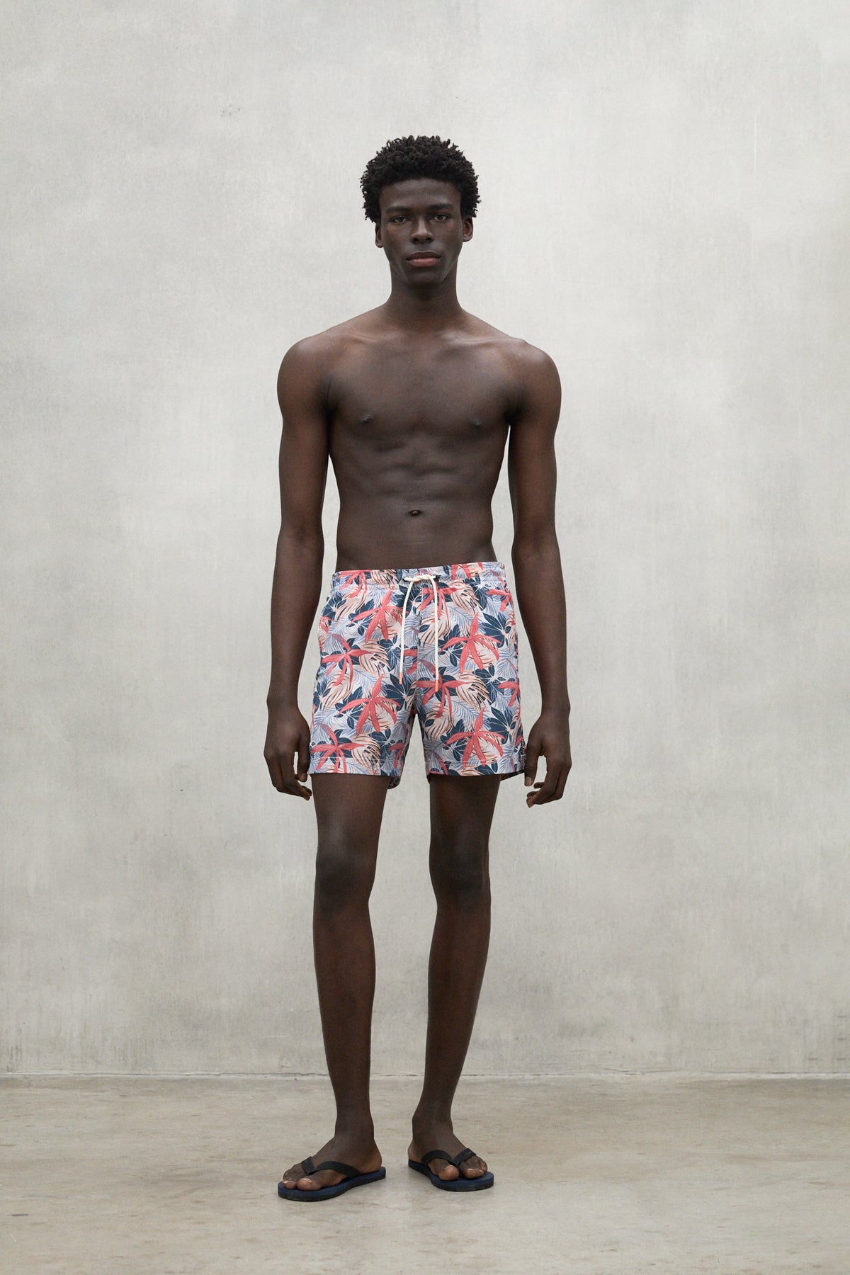 RED BEQUIA SWIM TRUNKS