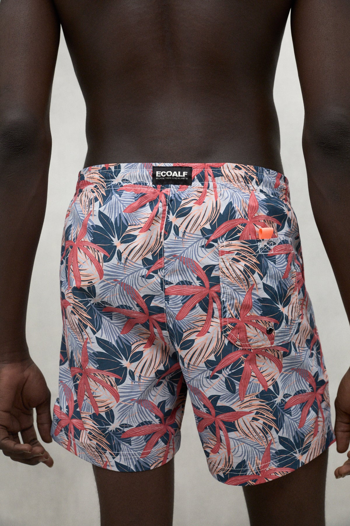 RED BEQUIA SWIM TRUNKS