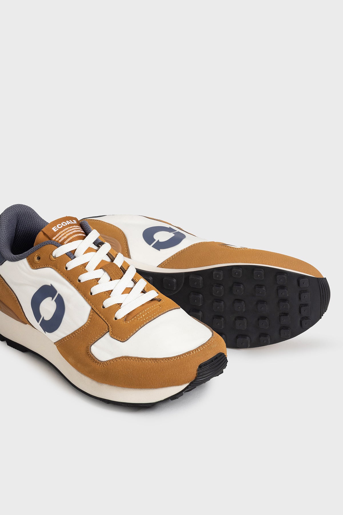 BEIGE AND ORANGE UCLA TRAINERS
